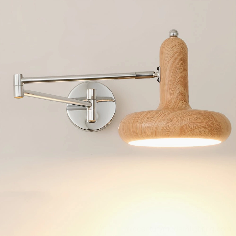 Milena adjustable swing arm wall sconce close-up showing wide disc lampshade and extendable metal arm mechanism, studio shot