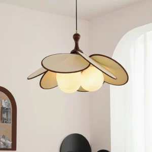 Miley mid-century modern pendant light installed in French-style living room with warm glowing bulbs