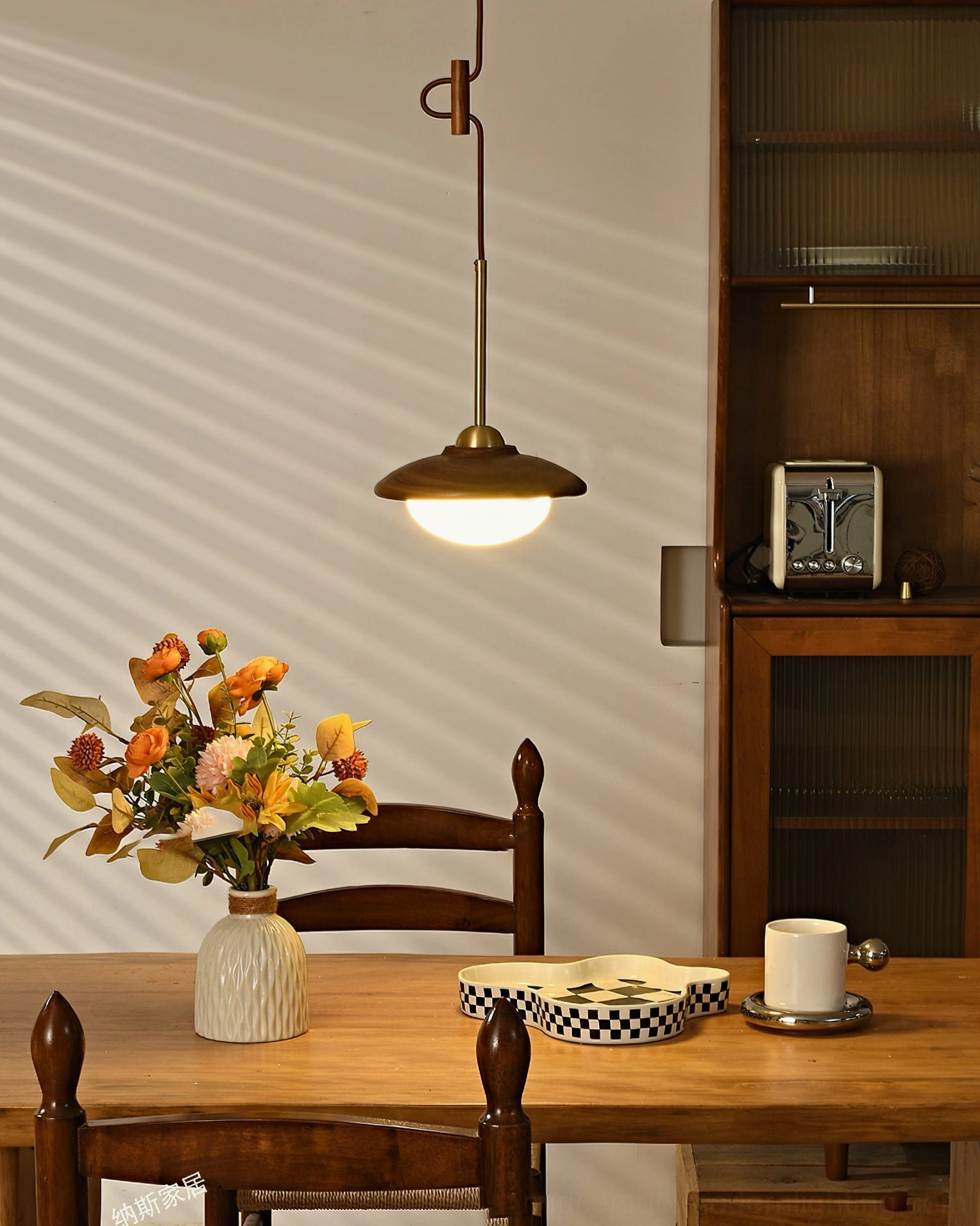 Milivia mid-century pendant light with decorative C-shaped brass hanging hardware