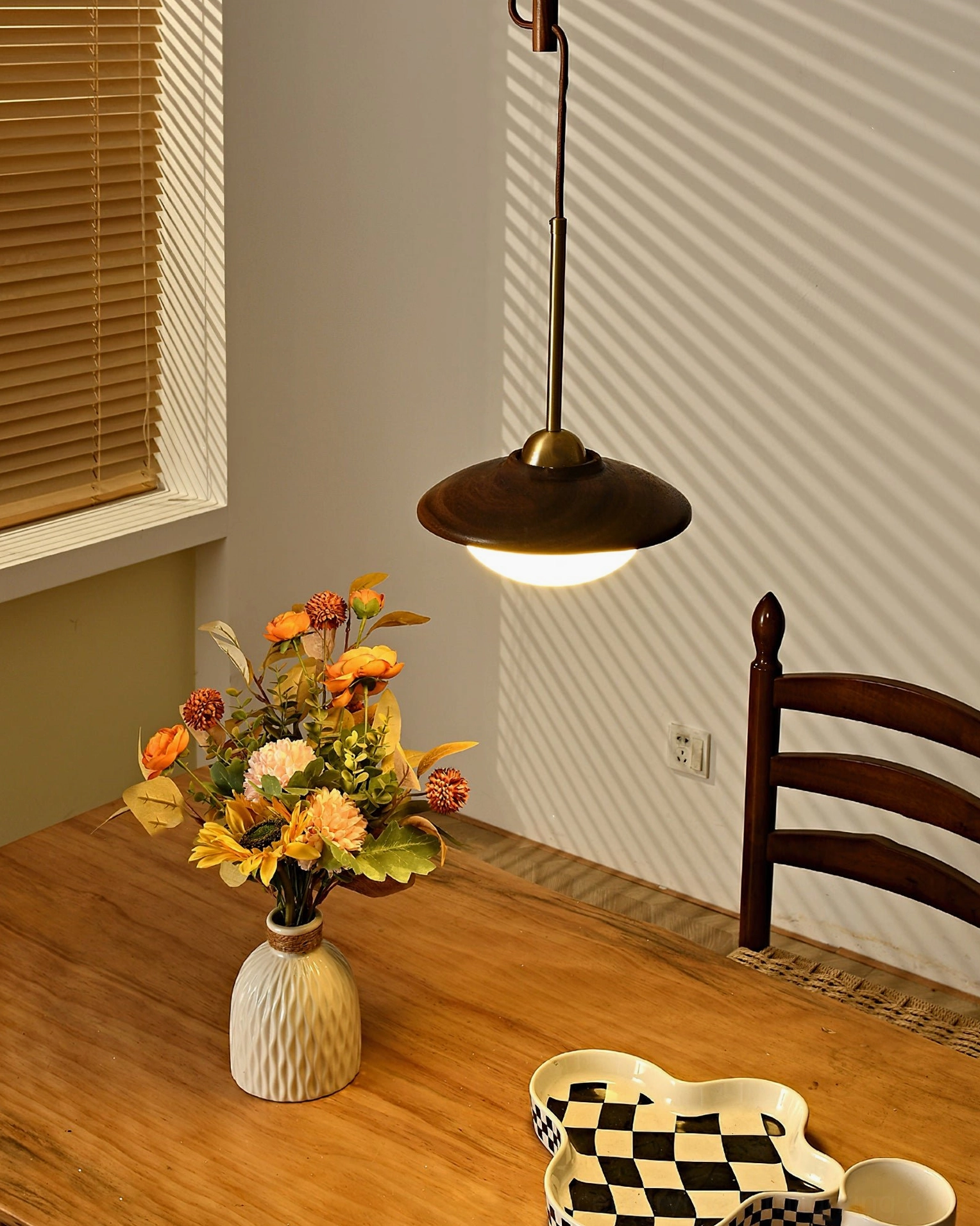 Single Milivia retro pendant light close-up - glowing frosted glass interior detail