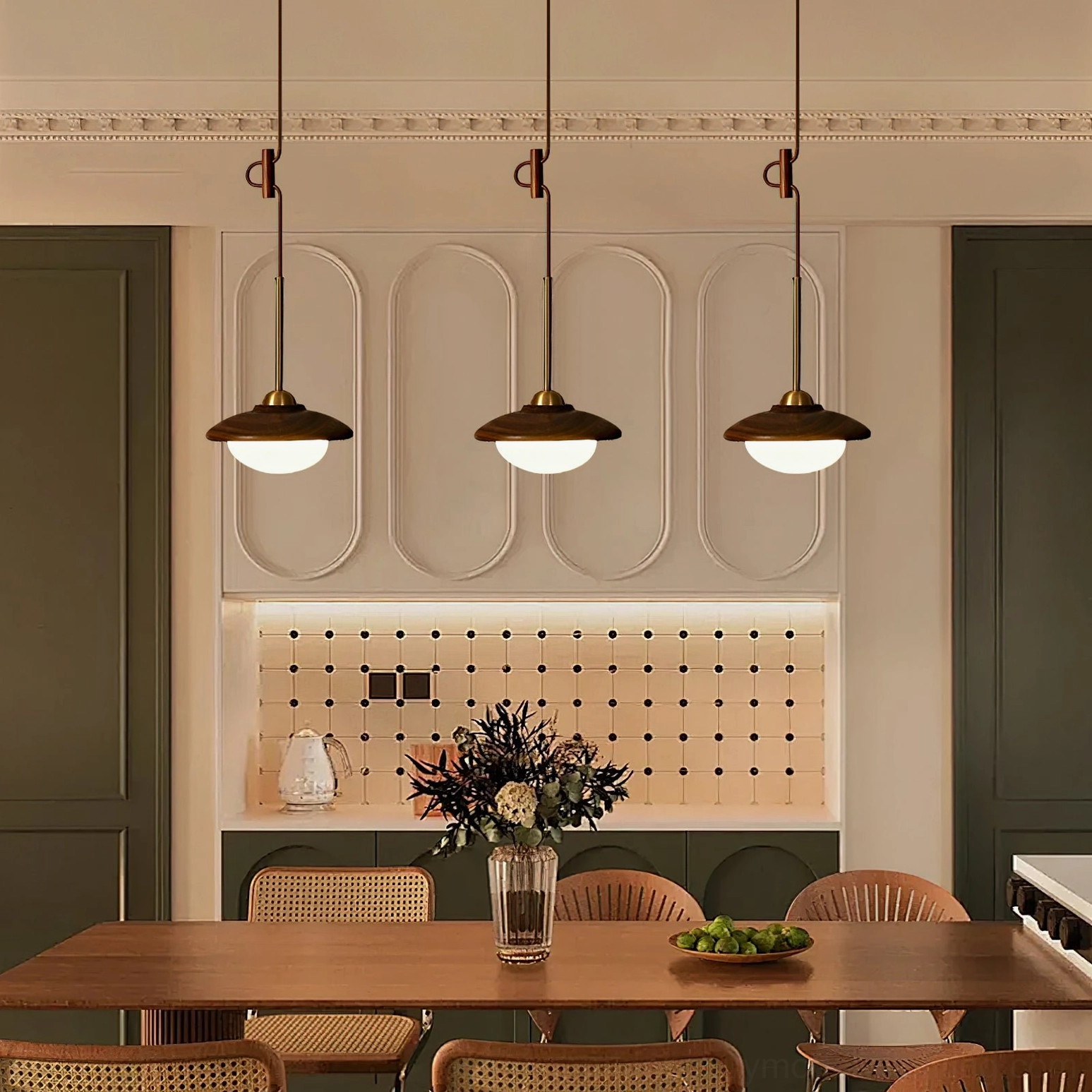 Three matching Milivia mid-century pendant lights in formal dining kitchen space