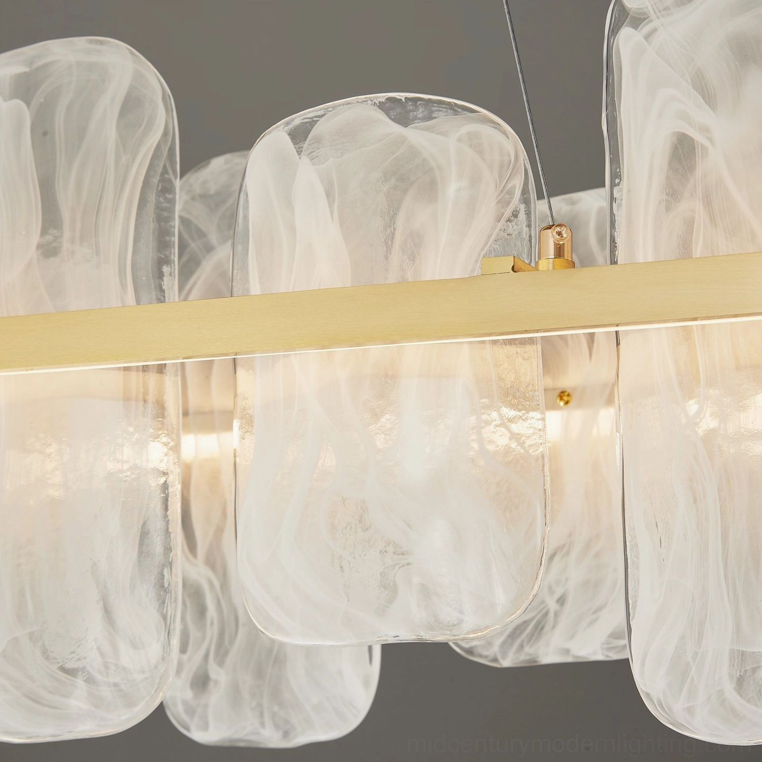 Contemporary oval pendant lighting fixture with minimalist brass frame and frosted glass shade design