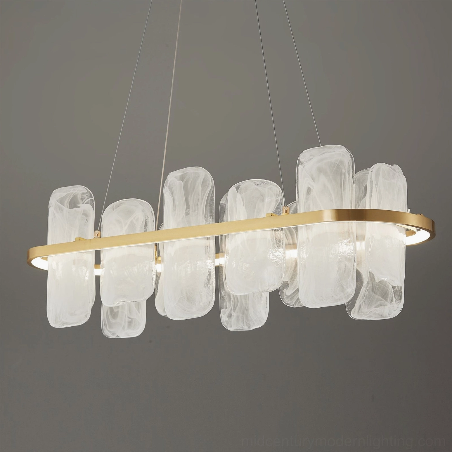 Contemporary oval glass pendant chandelier with multiple frosted shade elements on brass framework