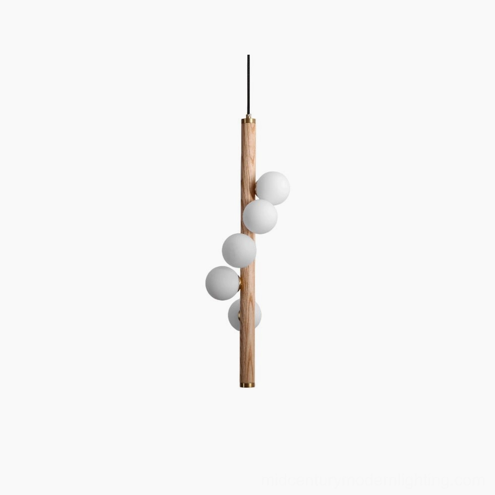 Miller wooden pendant light with frosted glass globes, frontal studio view showing natural wood construction and brass details