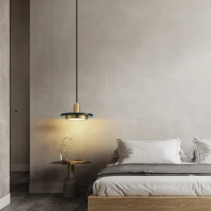 Milo pendant light fixture with brass and dark marble in modern bedroom setting