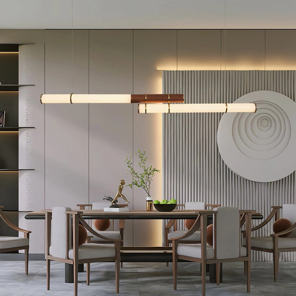 Contemporary dining space with Mini Endless Double pendant providing warm illumination above dining surface