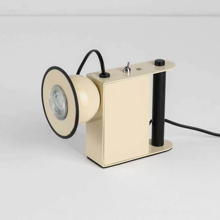 Beige Minibox compact industrial task lamp, front view, sculptural matte finish, studio lighting