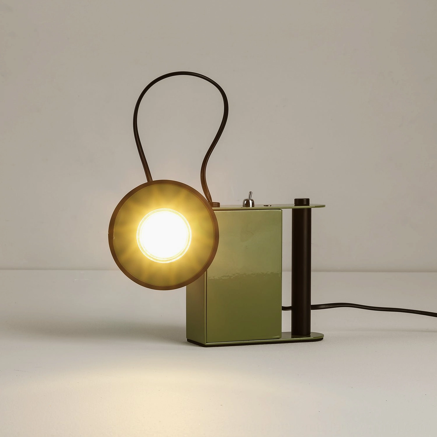 Minibox table lamp beige colorway, three-quarter view showing magnetic head attachment and cylindrical handle detail