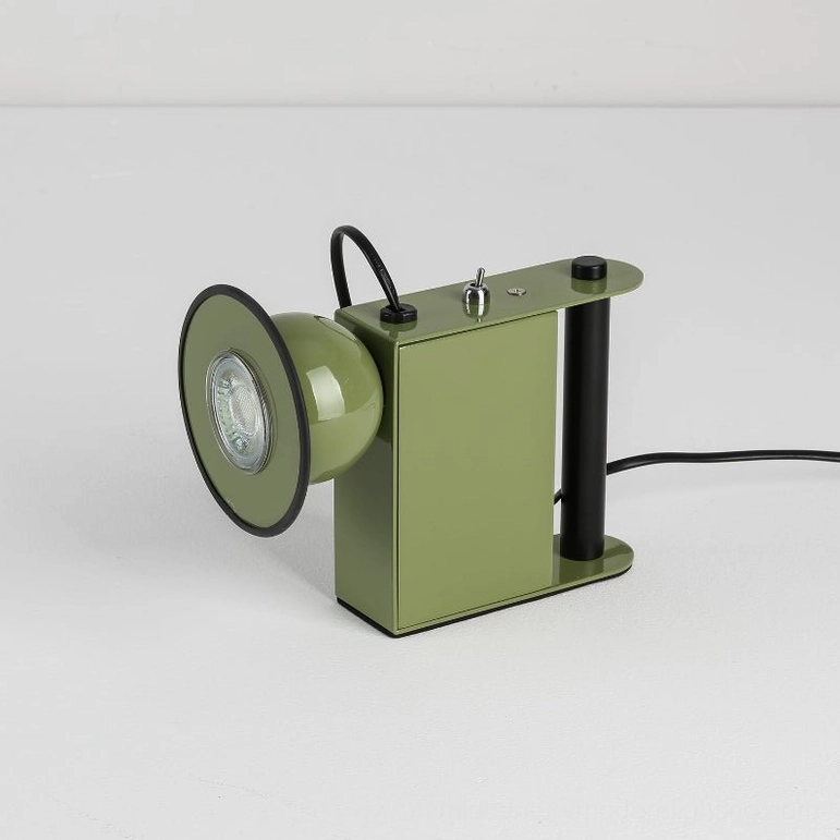 Minibox table lamp in sage green, three-quarter angle showing exposed LED bulb and geometric boxy form