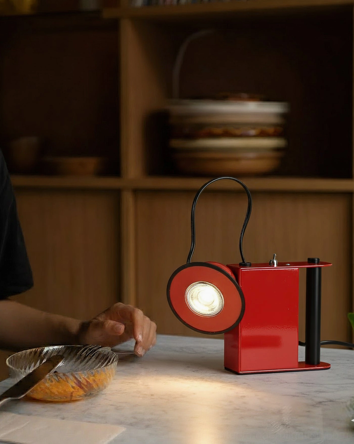 Minibox industrial table lamp on wooden dining table shelf, warm ambient lighting, hand-scaled detail shot, home styling