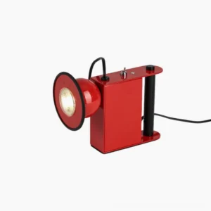 Minibox magnetic spotlight table lamp in bright red, three-quarter view, studio shot with geometric boxy design and glowing spotlight head