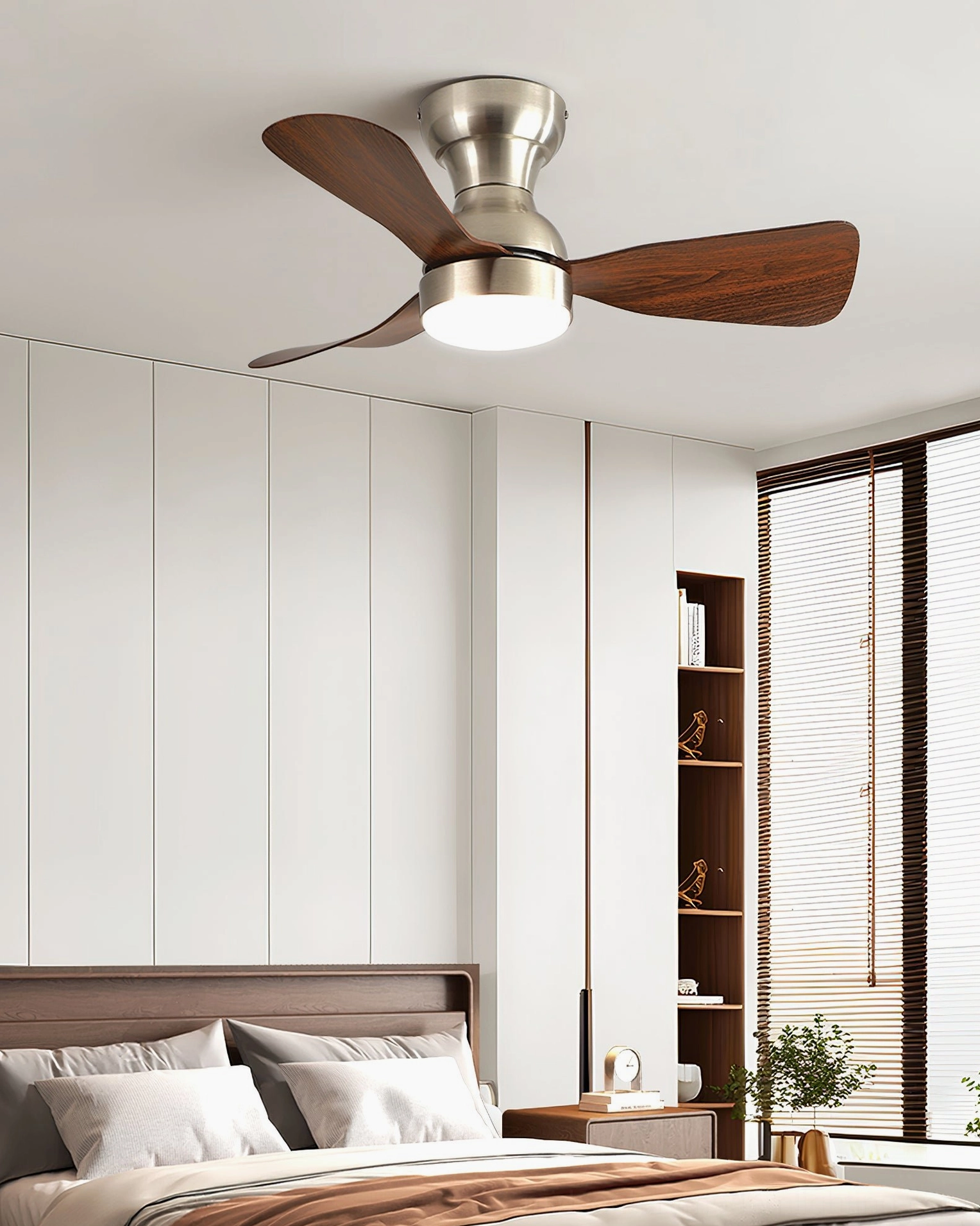 Modern minimalist bedroom with built-in shelving and installed ceiling fan light with dark wood grain blades in bright neutral interior design