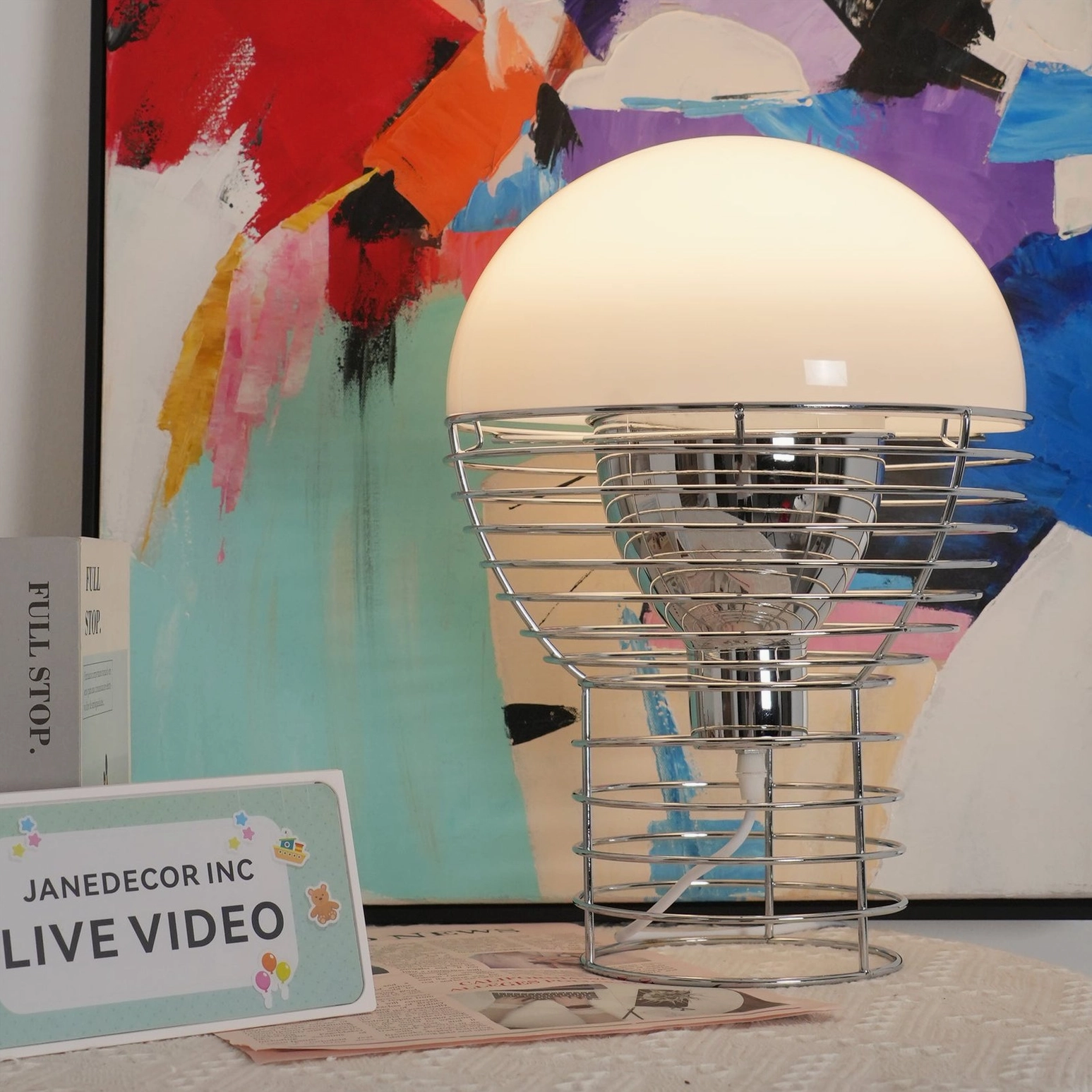 Geometric wire cage table lamp full front view highlighting spiral metal framework design