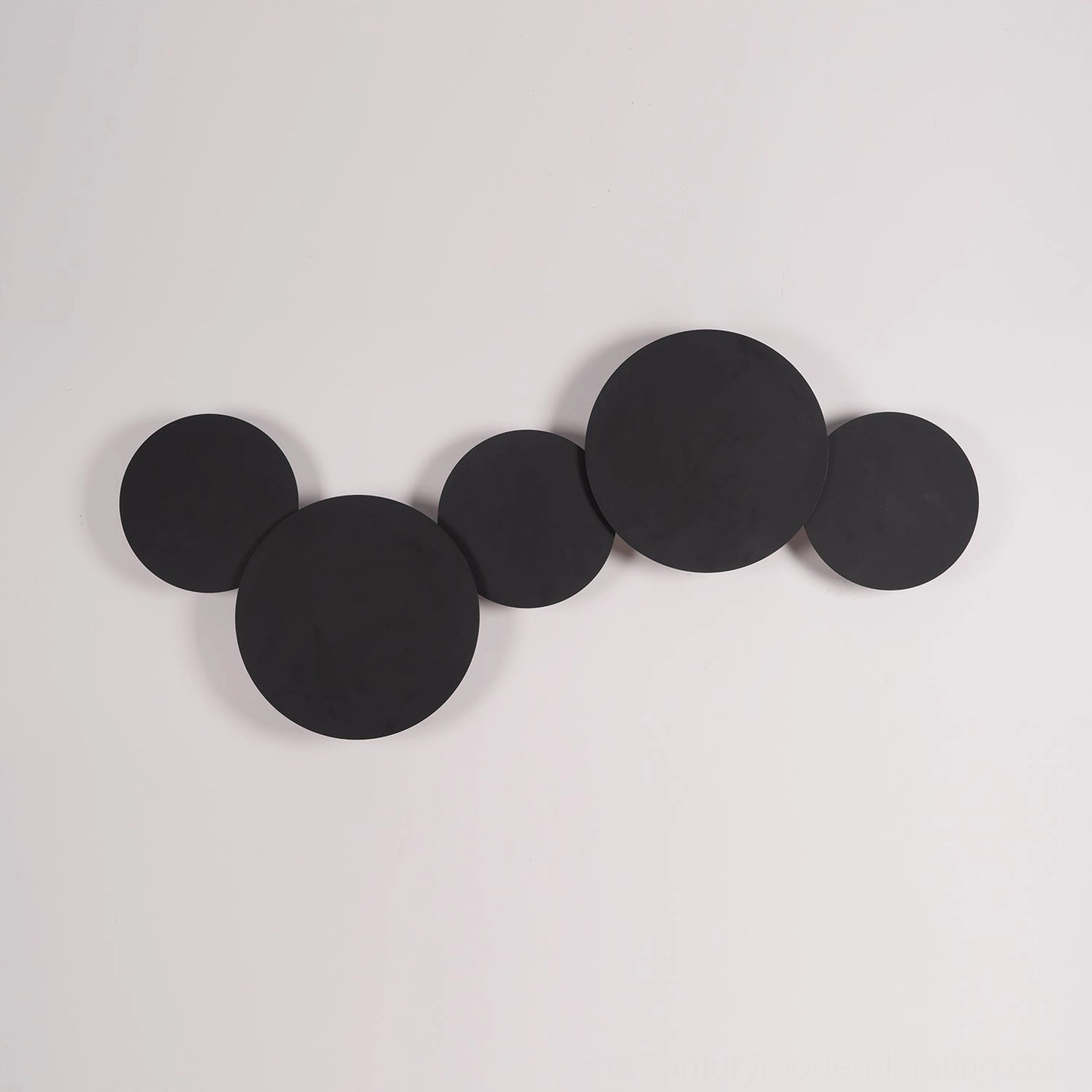 Contemporary minimalist geometric disc wall sconce with Scandinavian design influence and precise architectural lines