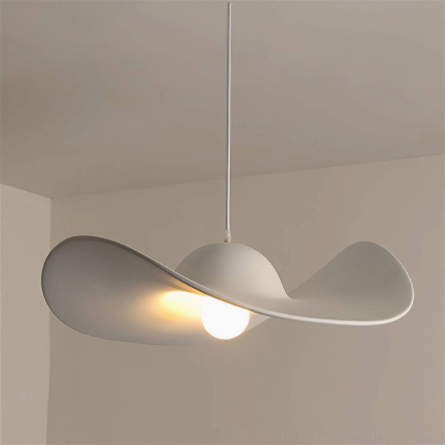 Minimalist hat pendant light showing clean proportions and smooth curves
