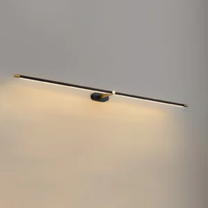 Close-up detail of modern linear LED wall lamp showing warm ambient glow and metal hardware
