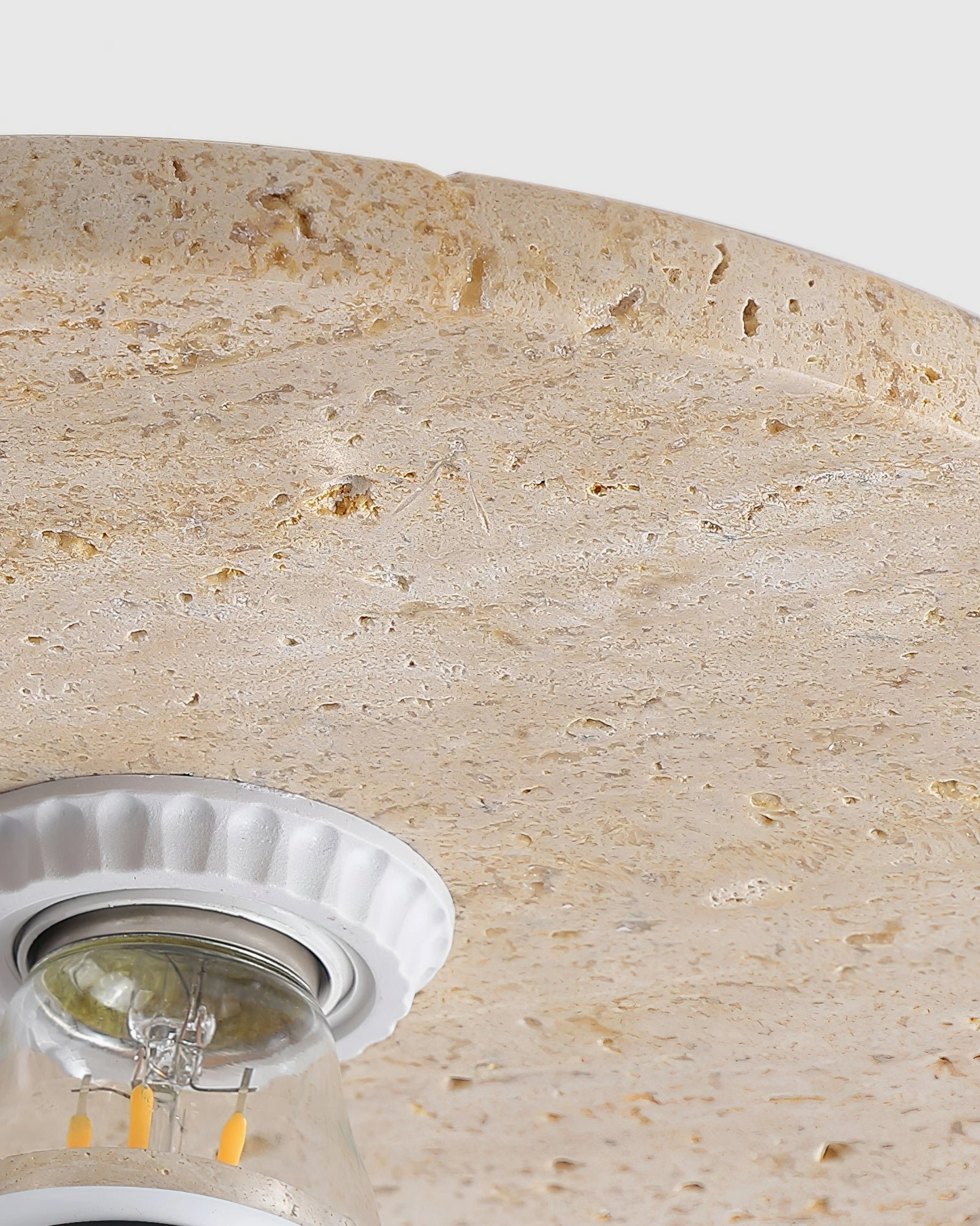 Minimalist ceiling mounted travertine light fixture contemporary residential home interior design aesthetic