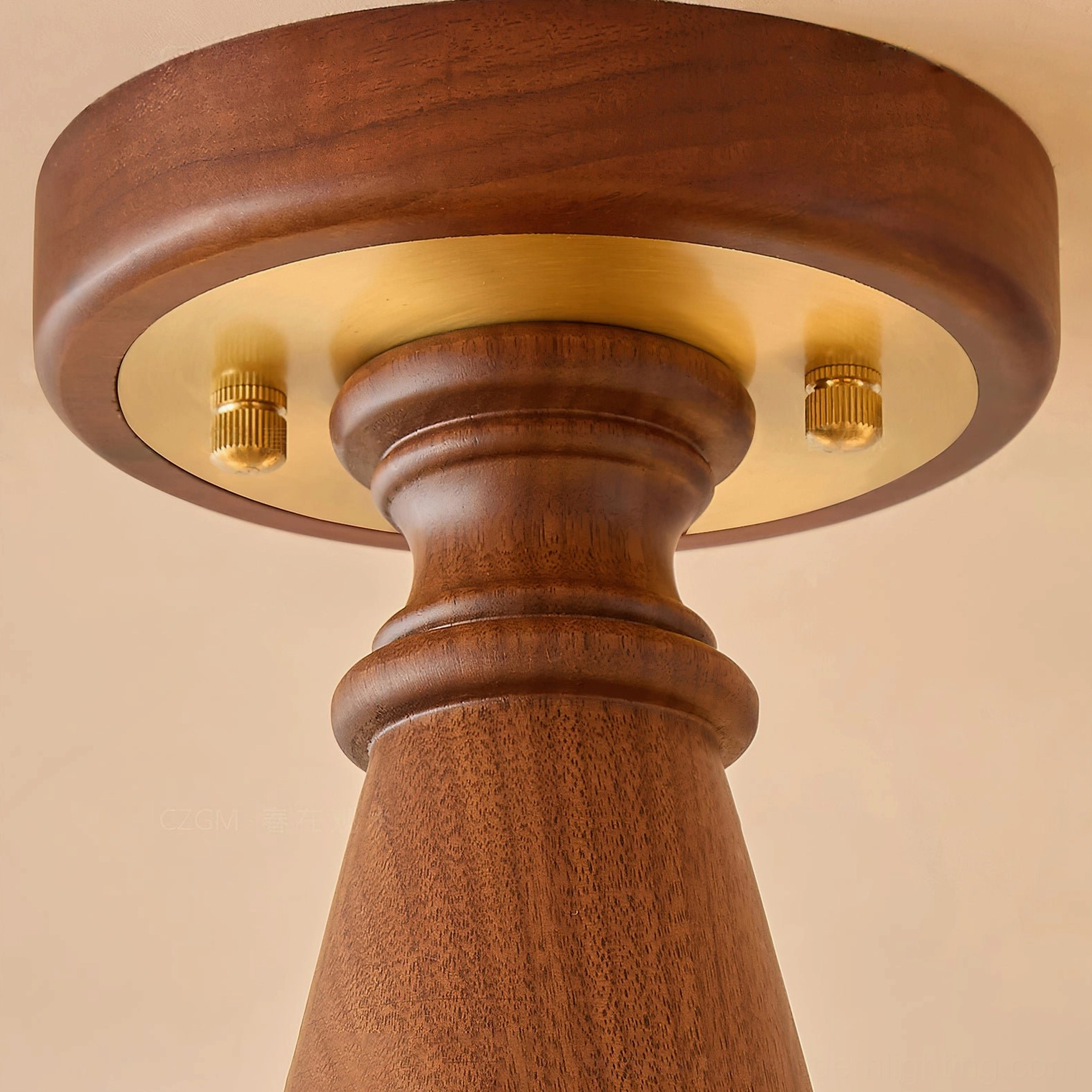Mirabelle chandelier ceiling mount base close-up showing solid walnut wood top with brass metal mounting hardware and accents
