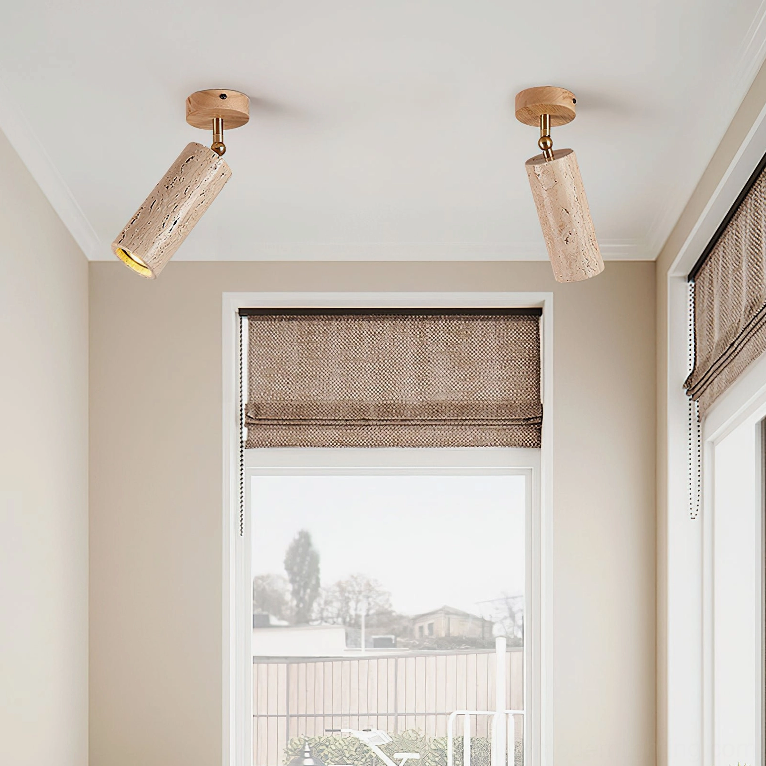 Pair of Mireille travertine ceiling lights in residential window nook showing warm minimalist interior styling with neutral tones