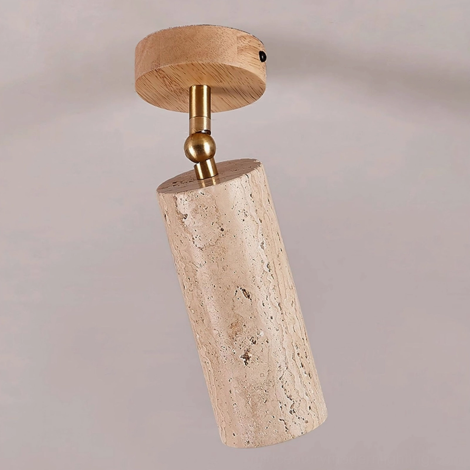 Mireille ceiling fixture with light wood canopy and smooth travertine surface finish on warm neutral background showing brass hardware
