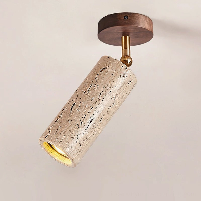 Mireille travertine ceiling light with dark walnut wood canopy showcasing natural stone texture and brass adjustable joint from front view