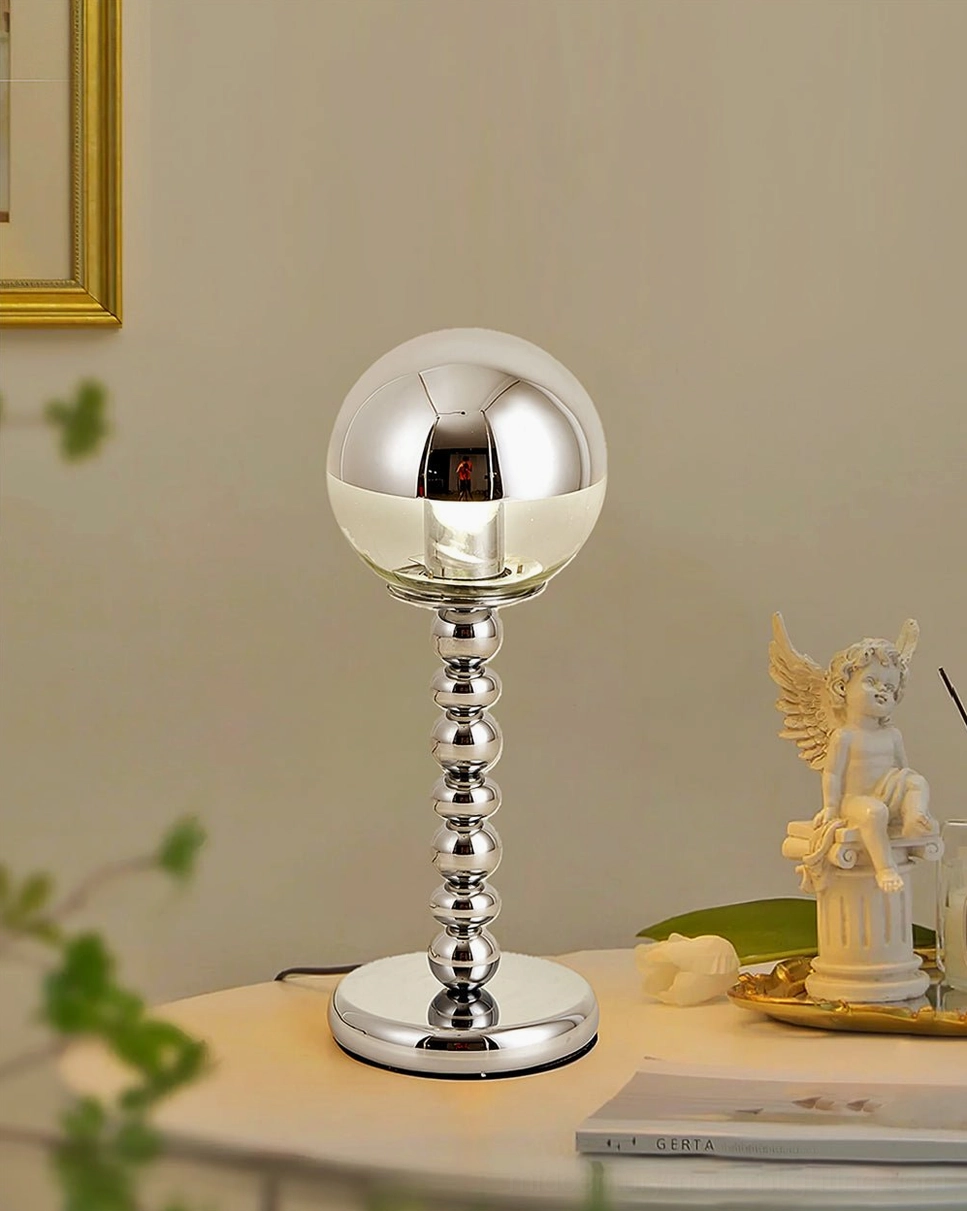Contemporary chrome Mirrorball sphere table lamp showcasing reflective surface and minimalist aesthetic