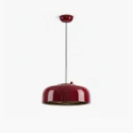 Burgundy red dome pendant light with glossy metal finish and black inner trim, studio photography