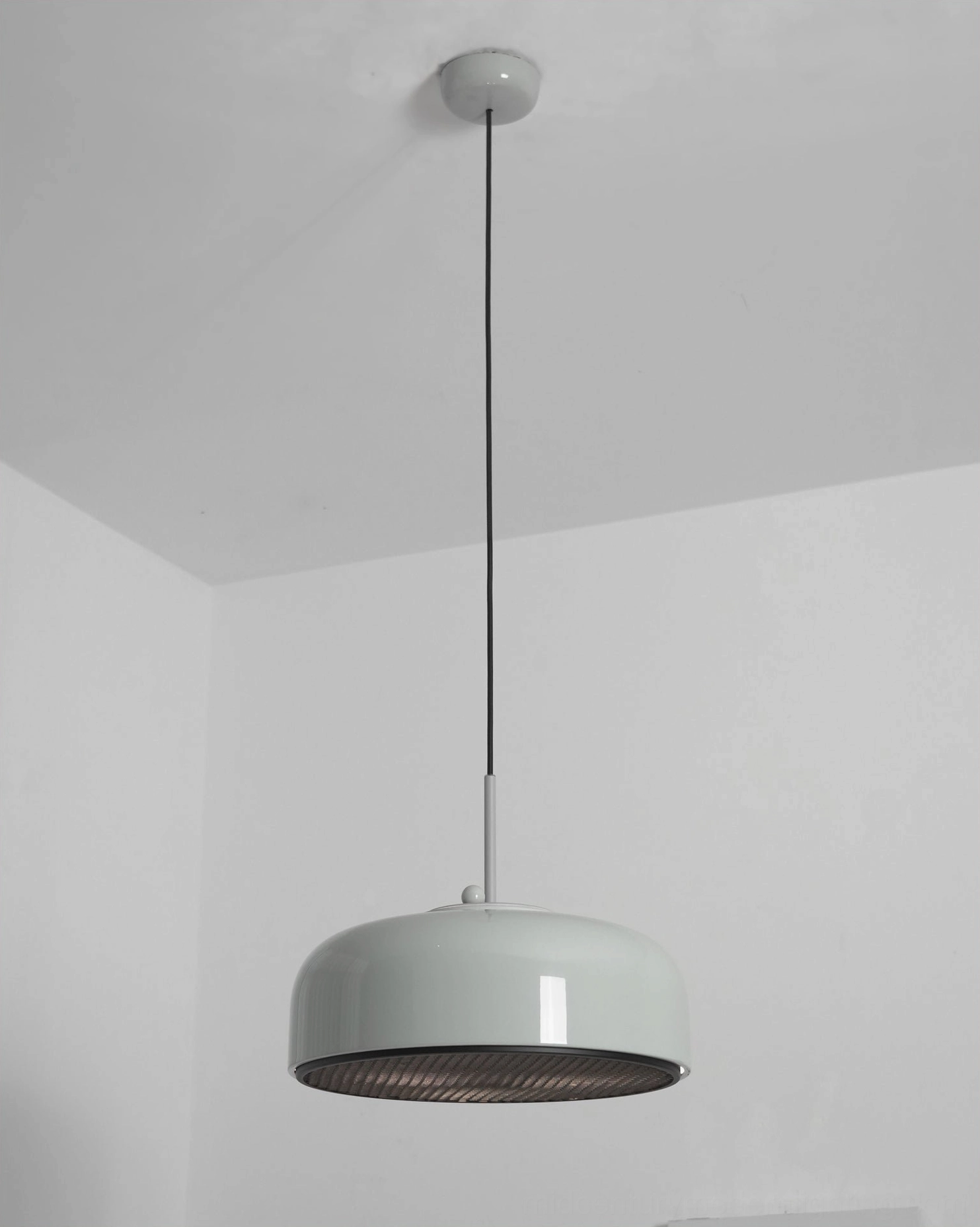 Misha dome pendant light illuminated showing light distribution and ambiance effect