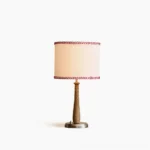 Mitchell baseball bat table lamp with wooden pole, chrome base, and embroidered baseball stitch linen shade—front view on white background