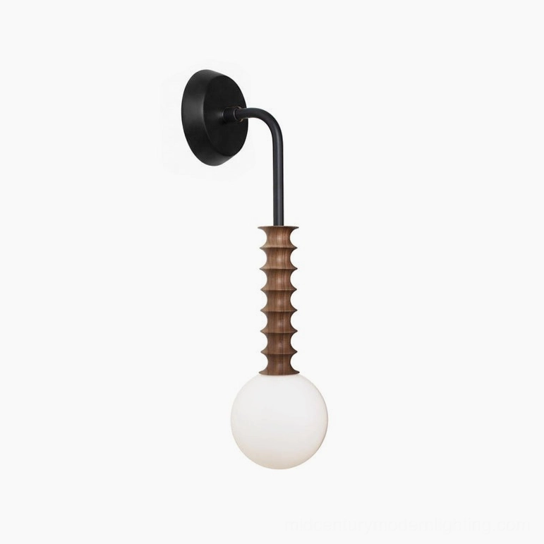 Mobo wall sconce front profile three-quarter view displaying black metal mounting and walnut wood backplate on white studio background