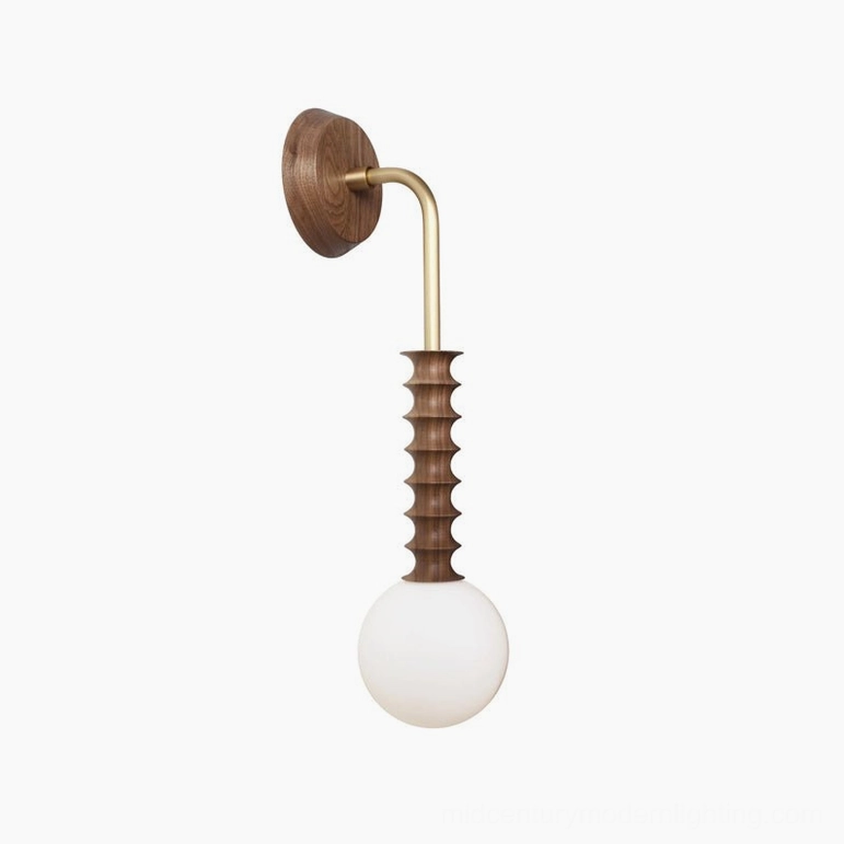 Mobo dual-tone wall sconce with brass arm and walnut wood accents in side profile view