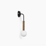 Mobo mid-century modern wall sconce with frosted globe diffuser and matte black metal arm on white background, showing side profile view