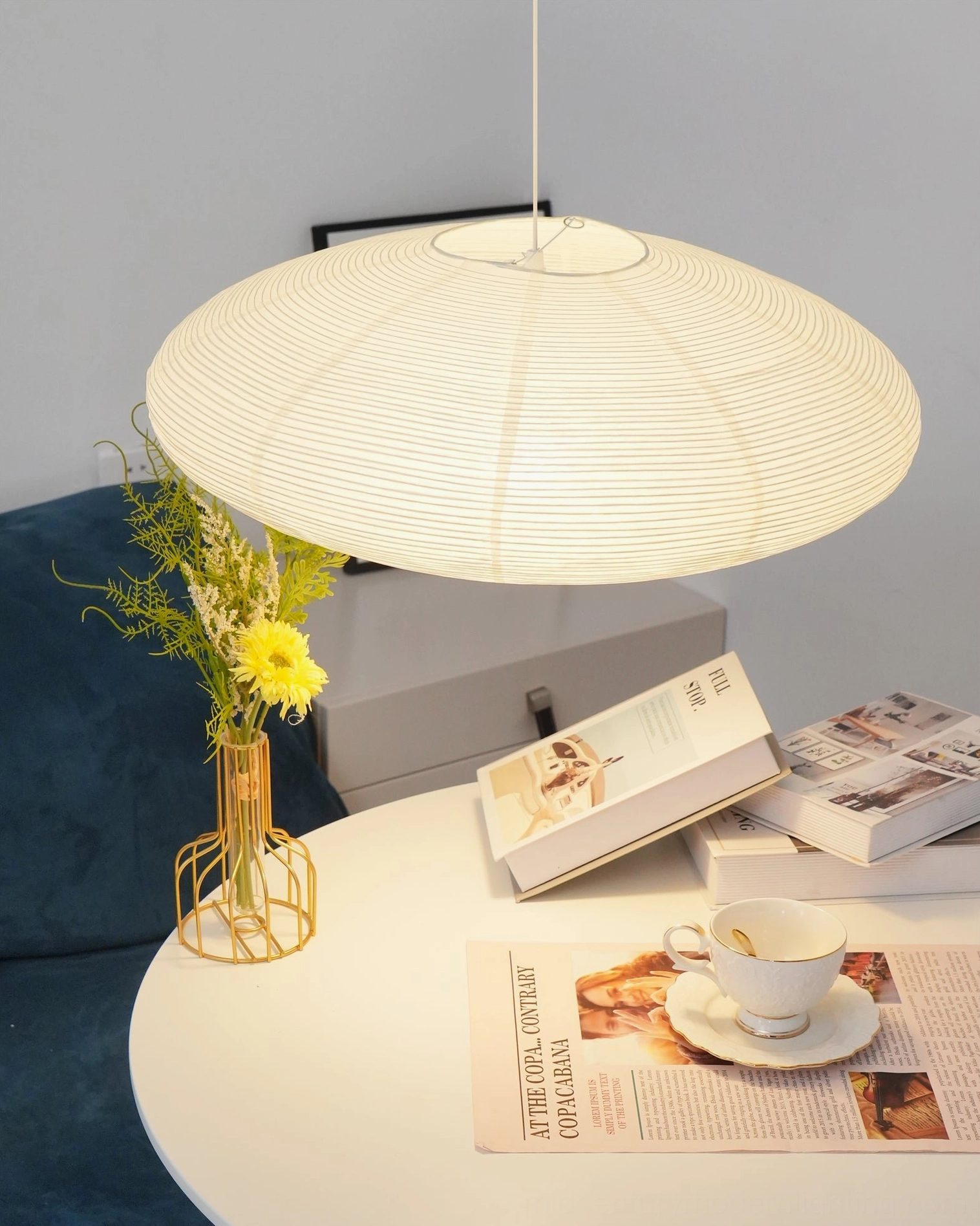 Model 15A large washi paper pendant light photographed in neutral studio setting emphasizing size and proportions