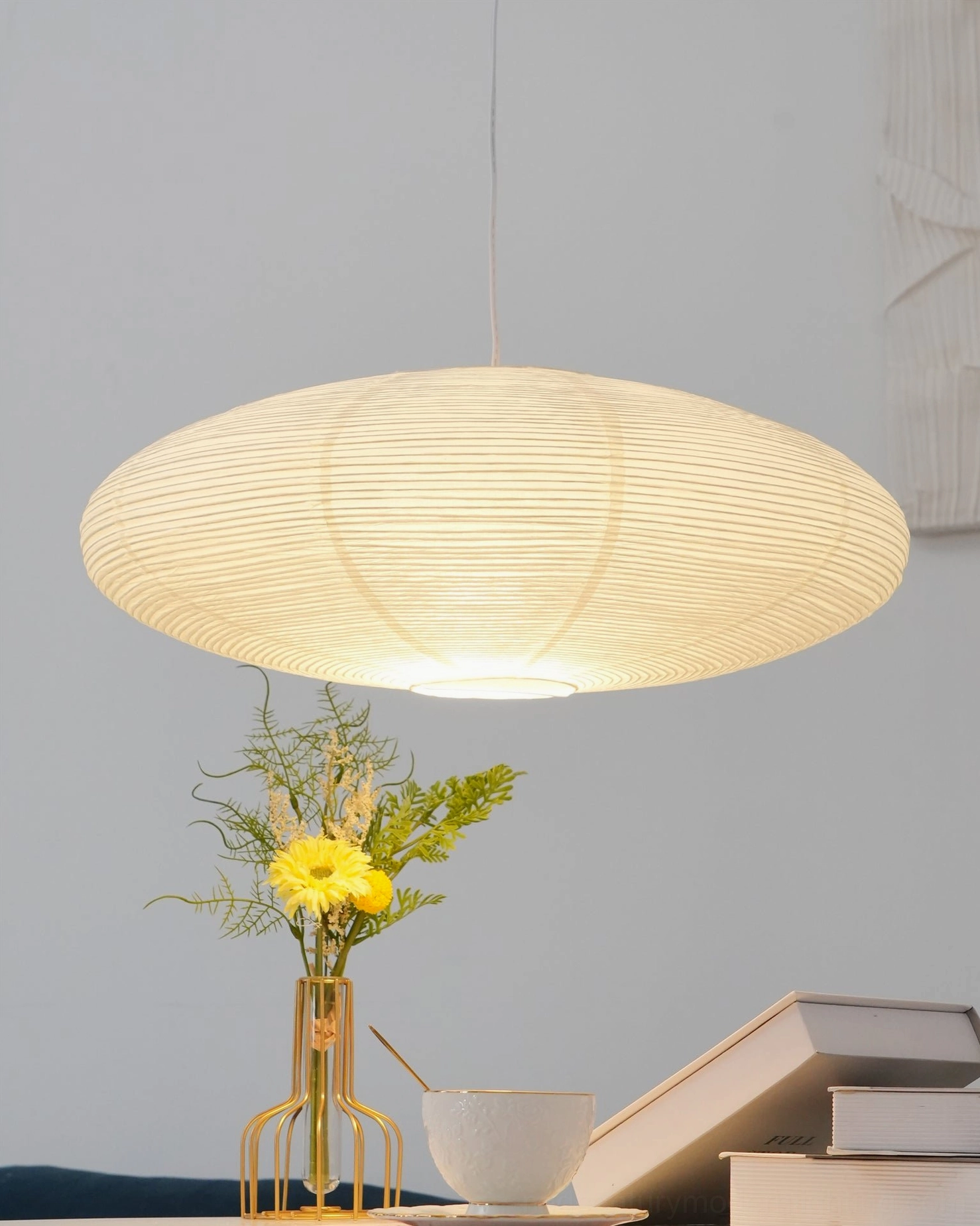 Model 26A compact washi pendant light in entryway application with warm diffused illumination