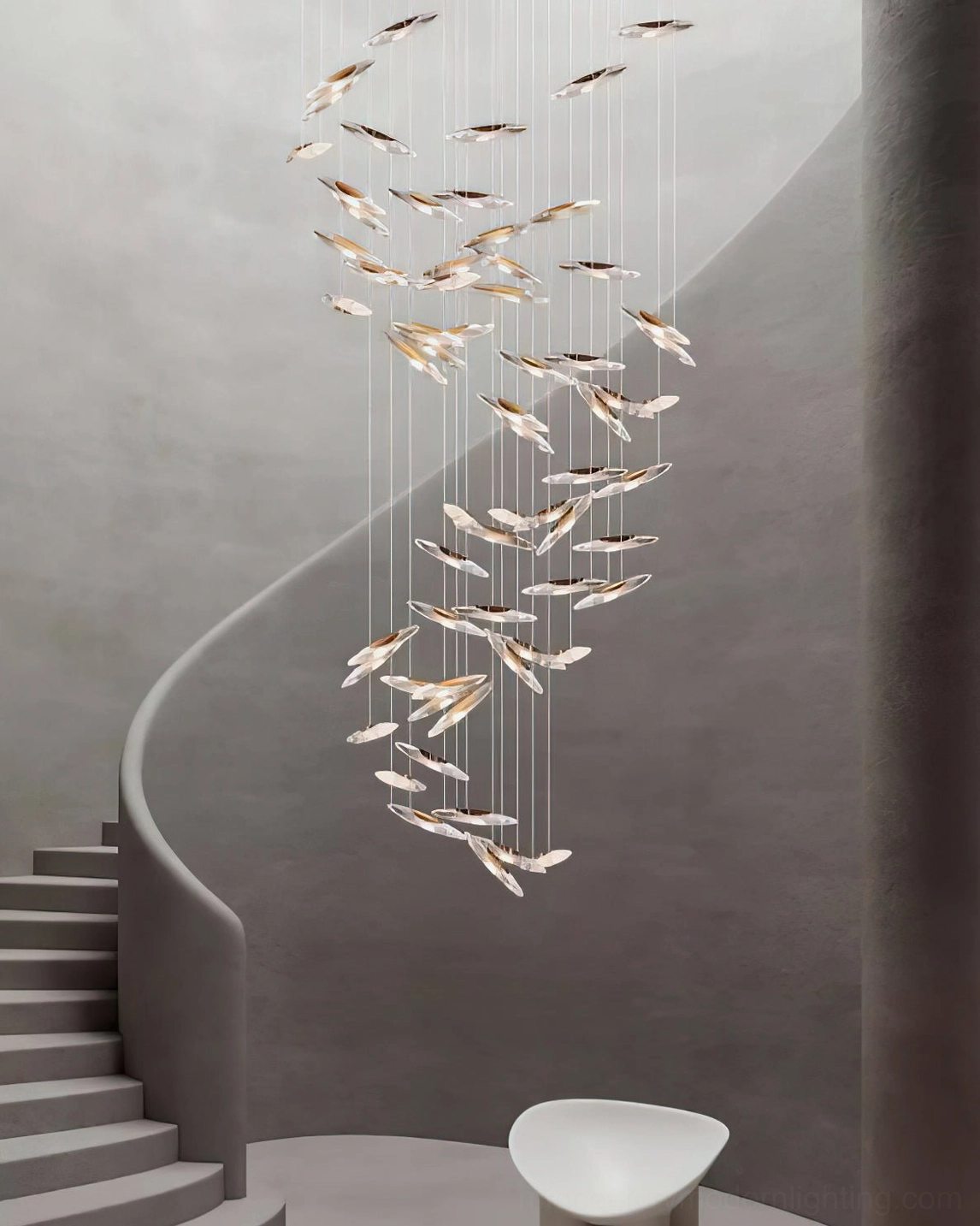 Modern architectural glass chandelier installation highlighting sculptural design principles