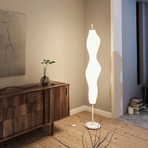 Modern organic floor lamp in minimalist living room with wood flooring and side cabinet