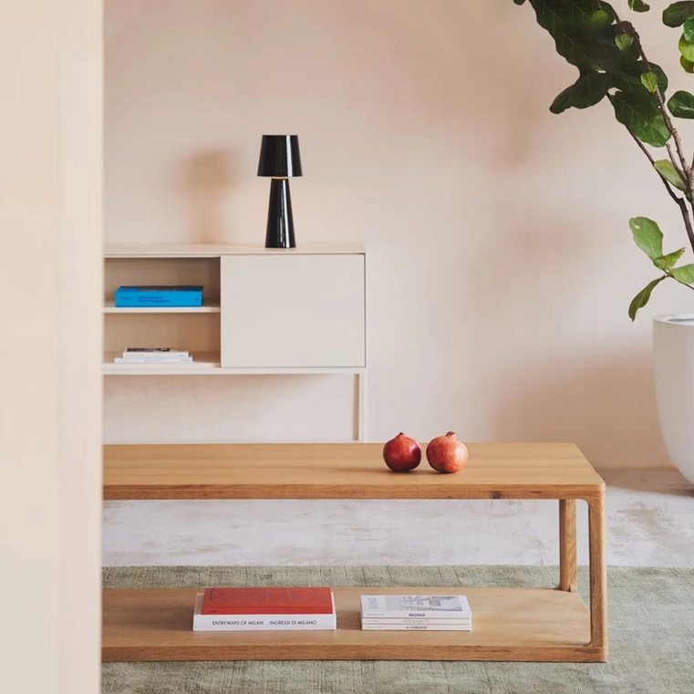 Black LED table lamp on minimalist console table with wooden decor in contemporary entryway