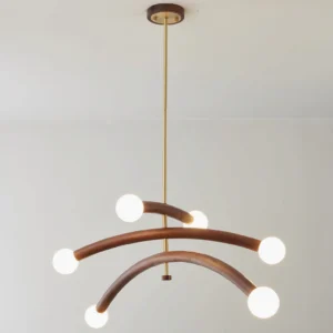 Mid-century modern branch chandelier with curved wooden arms and glowing white spherical bulbs in minimalist interior setting