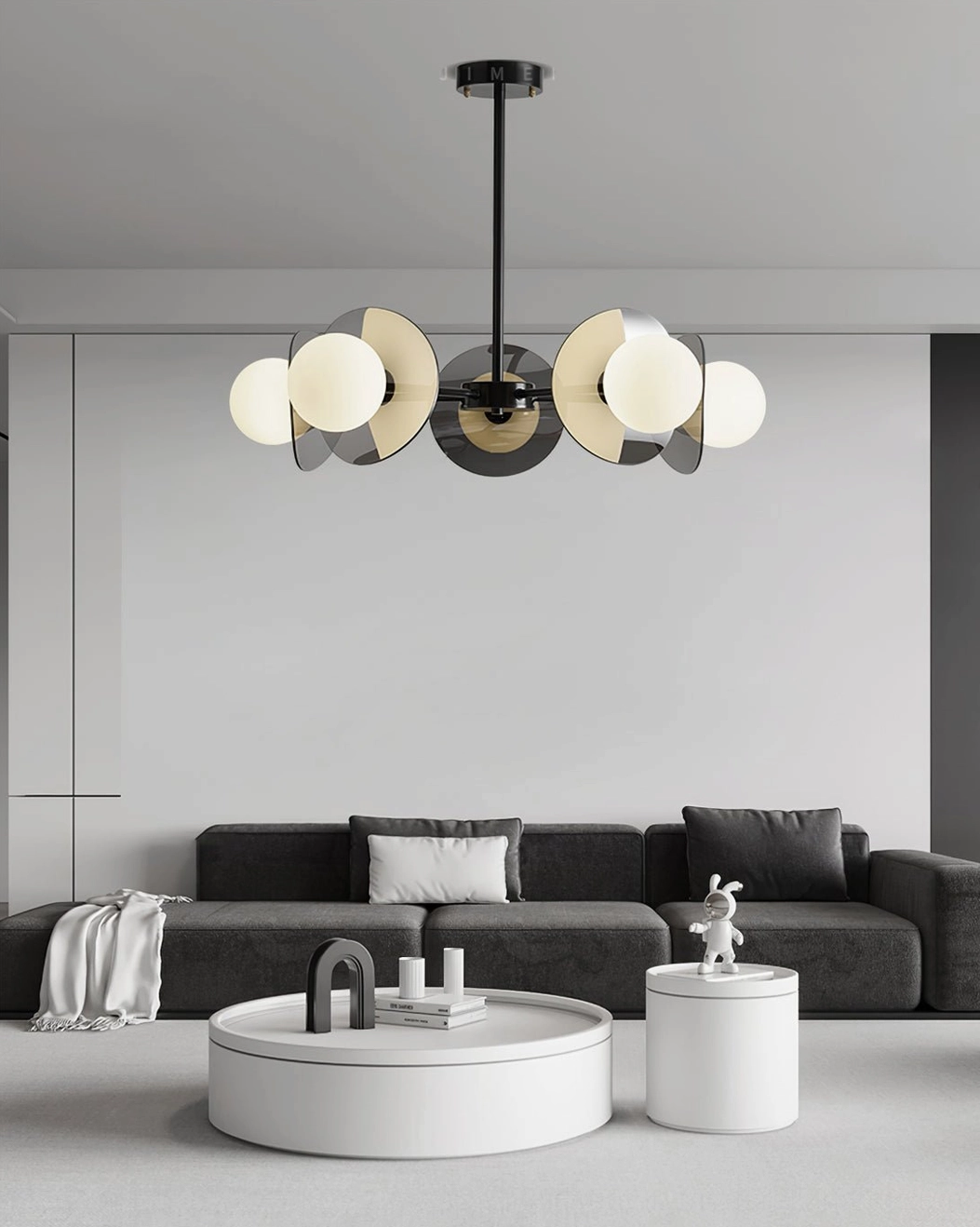Modern branch chandelier eye-level side view in minimalist living room with dark gray sofa and black metal frame
