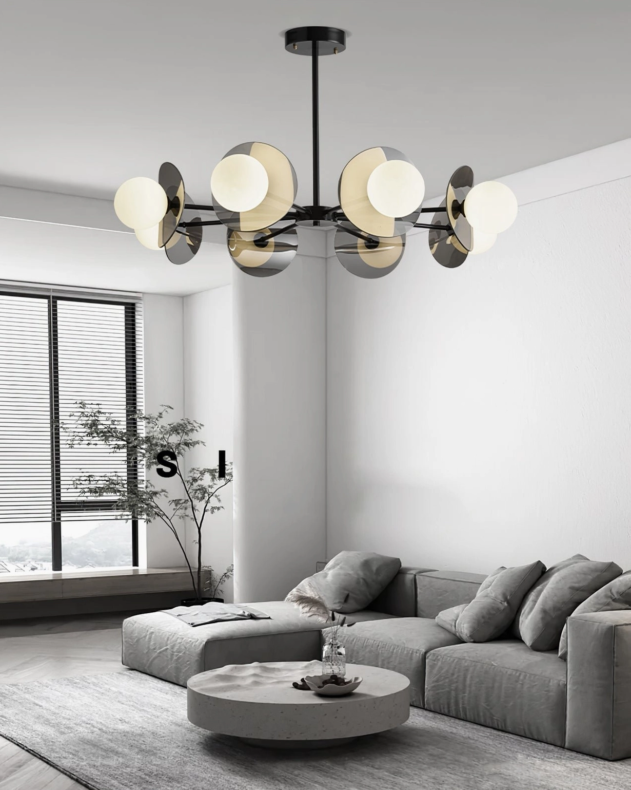 Modern branch chandelier eye-level side view in bright living room with floor windows and warm glowing illuminated lamps