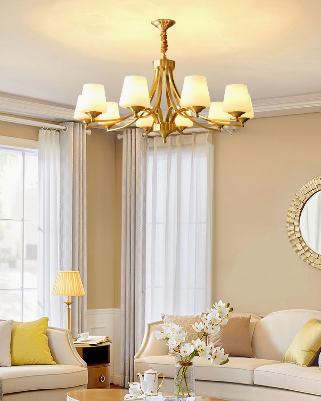 Mid-century modern brass chandelier in contemporary living room with beige sofa and warm home decor