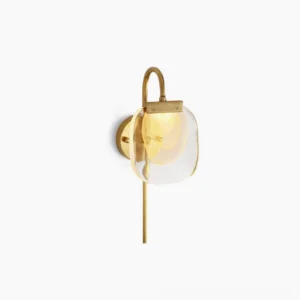 Satin brass wall sconce with frosted amber glass shade on white background - modern mid-century design