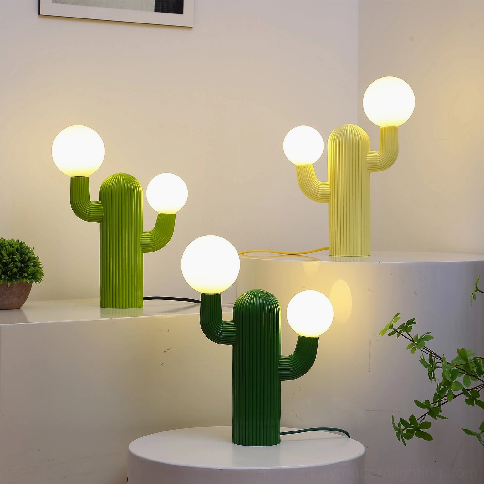 Illuminated green cactus table lamp with warm glowing bulbs in contemporary home interior setting