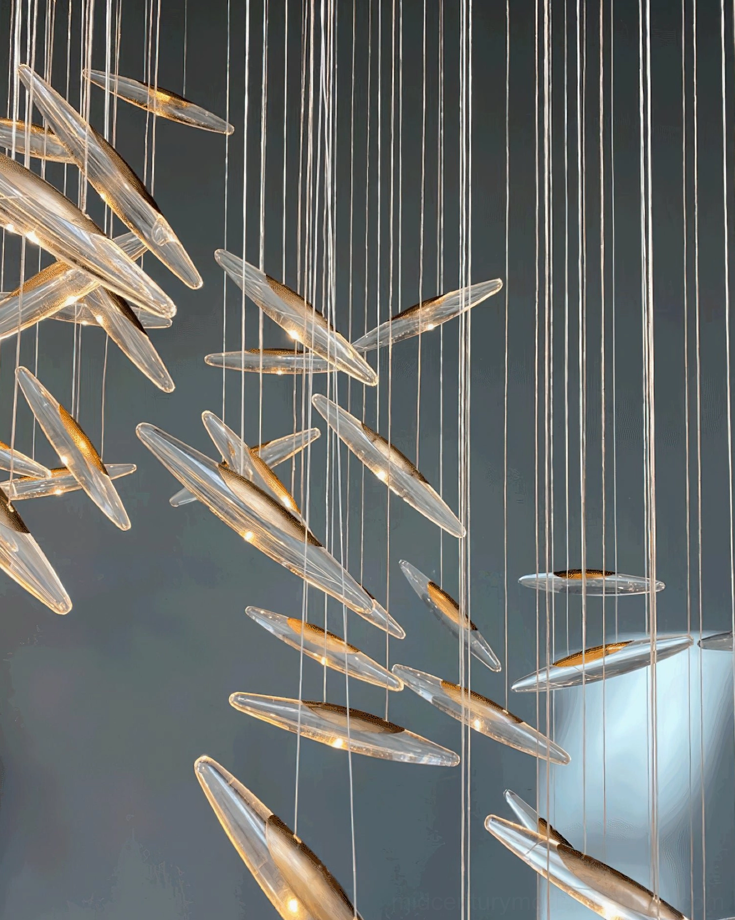 Modern cascading chandelier with refined glass elements in sophisticated contemporary setting