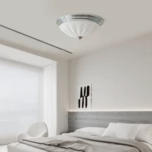 Modern minimalist ceiling lamp installed in contemporary master bedroom, warm neutral lighting, overhead indoor view