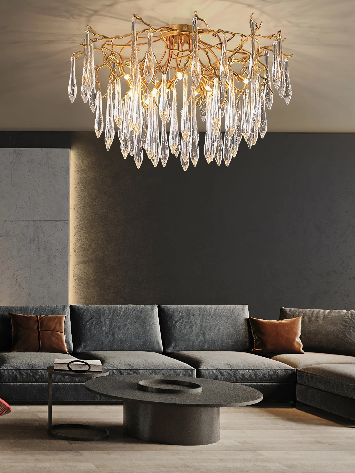Modern ceiling light fixture in contemporary living room with grey sofa, warm glowing illumination