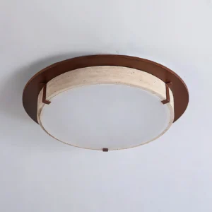 Close-up detail of modern ceiling light showing travertine stone trim and walnut wood frame from low angle