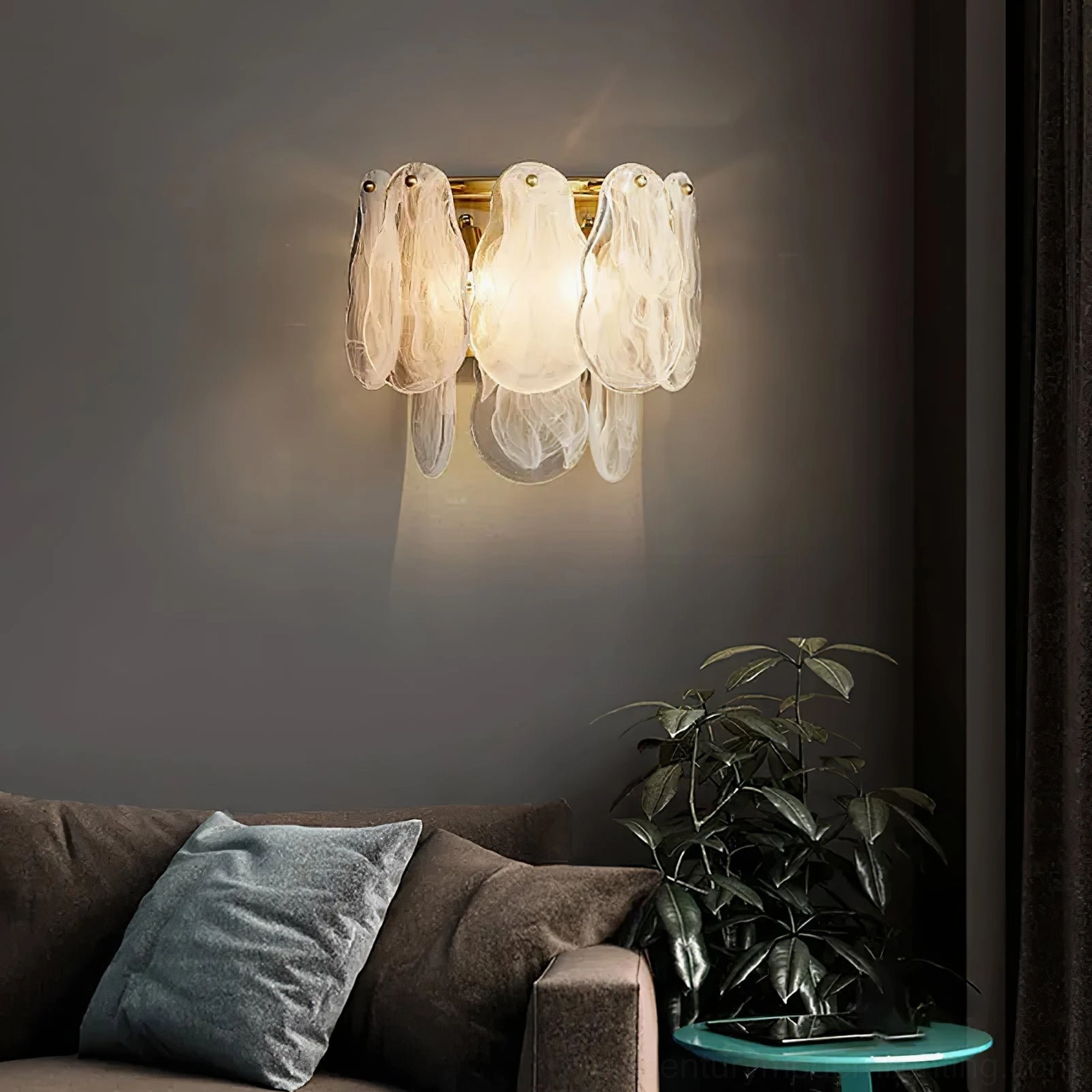 Modern cloud glass wall sconce mounted in styled interior, showcasing warm ambient lighting and frosted glass diffusion