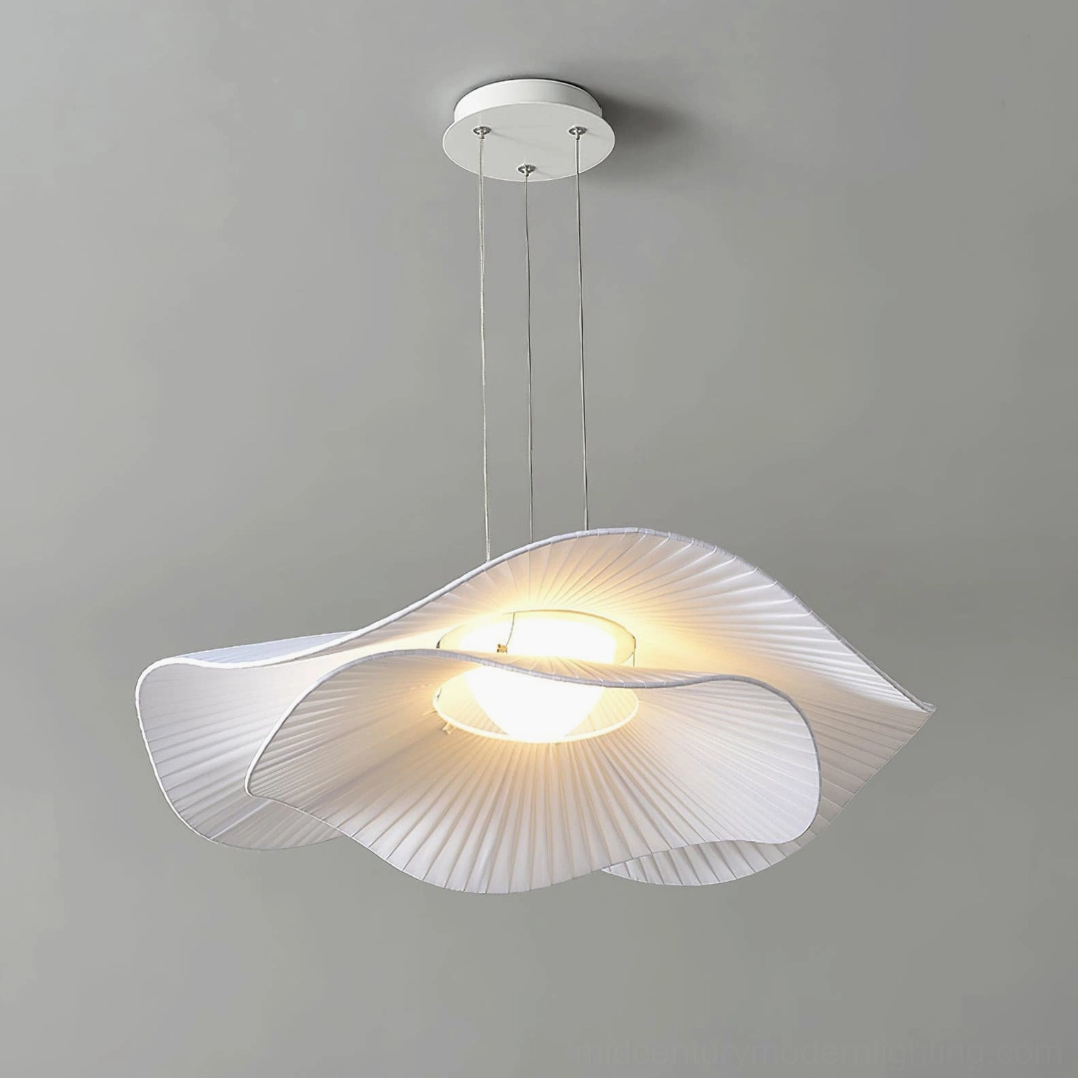 Modern pleated cloud pendant lamp three-quarter front view showing layered fabric texture