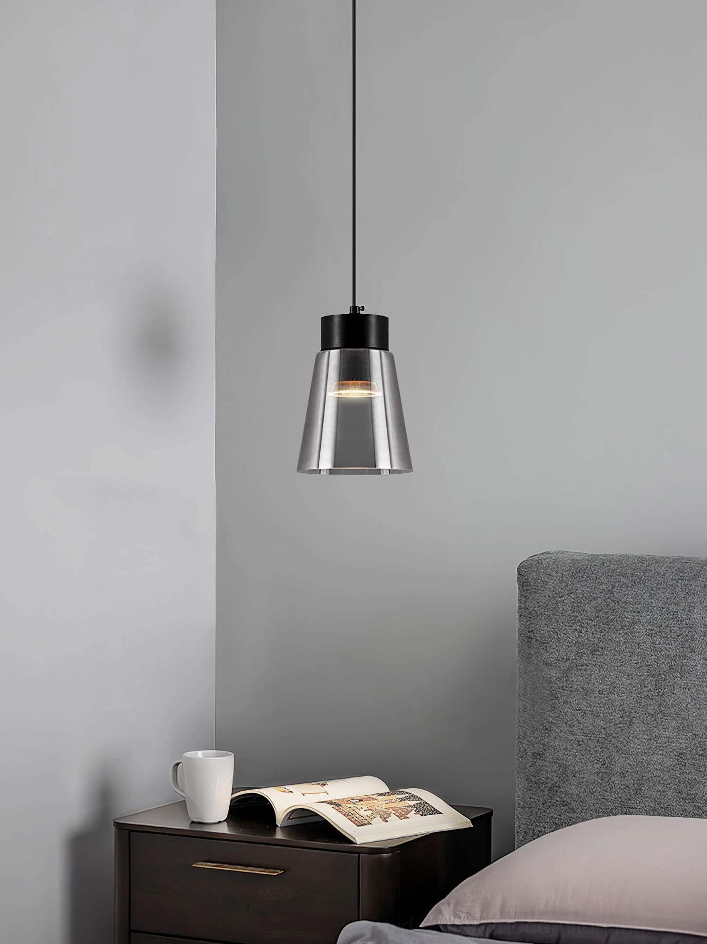 Contemporary smoke grey cone pendant in minimalist bedroom corner with reading nook